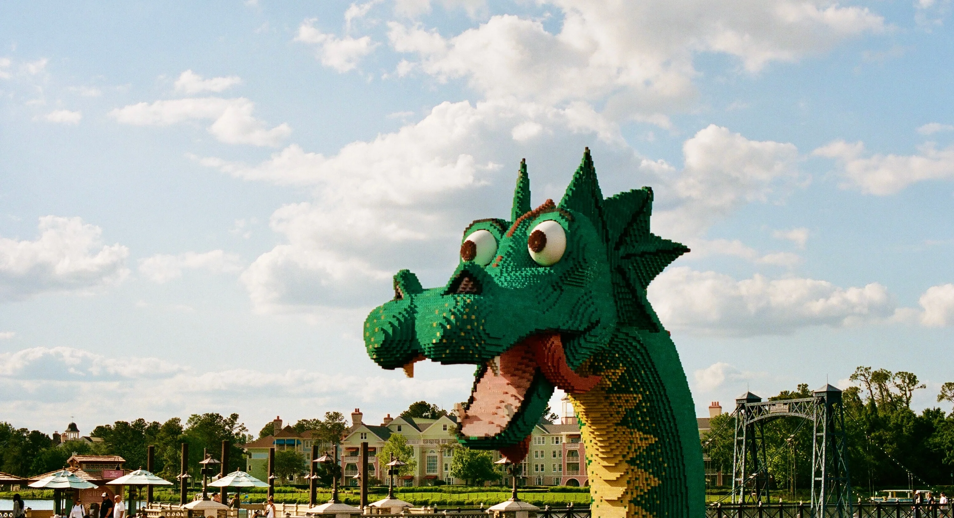 A green dragon sculpture rising above the waterfront in Orlando