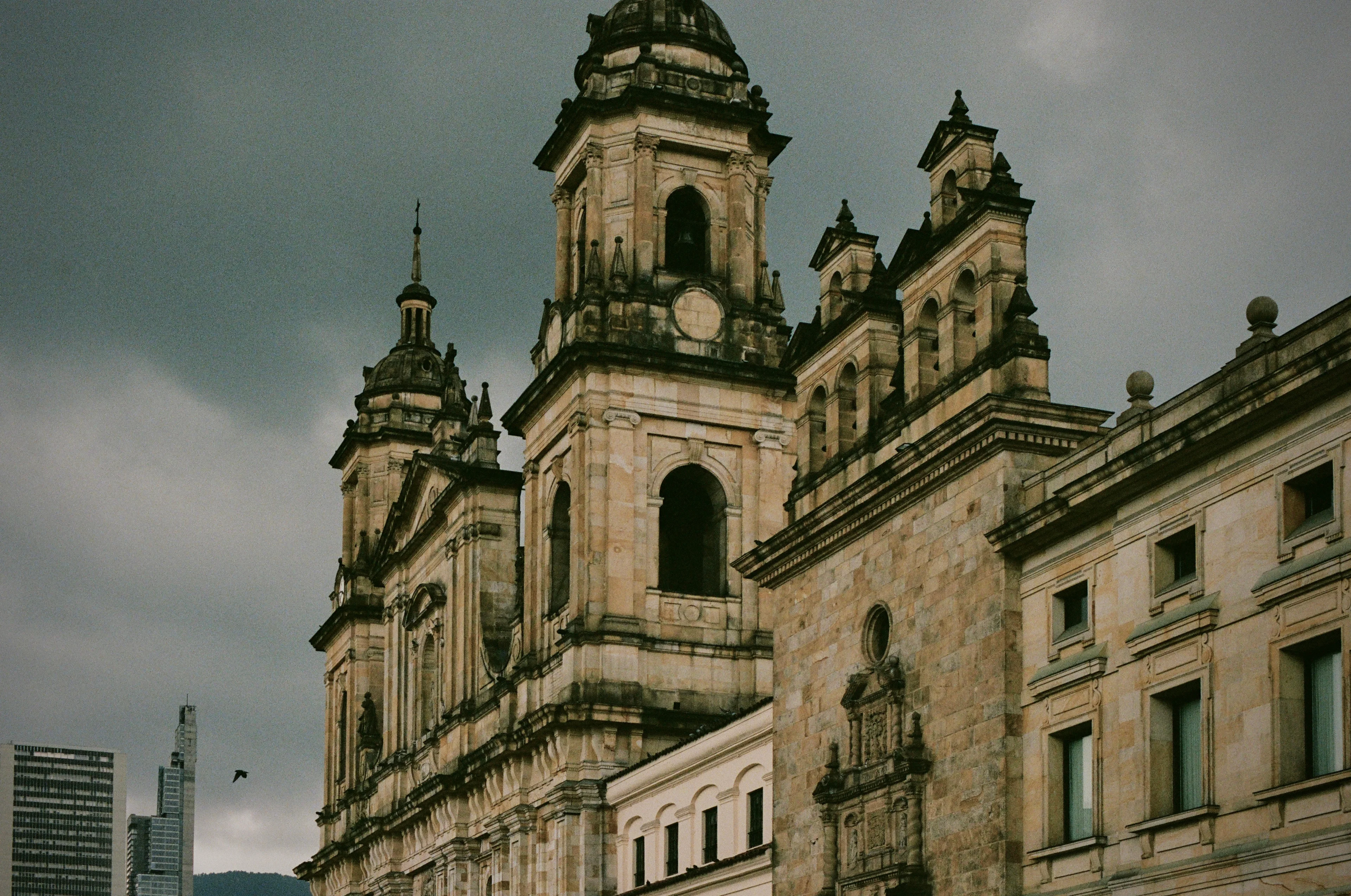 Twin church towers beneath an overcast sky in Bogota