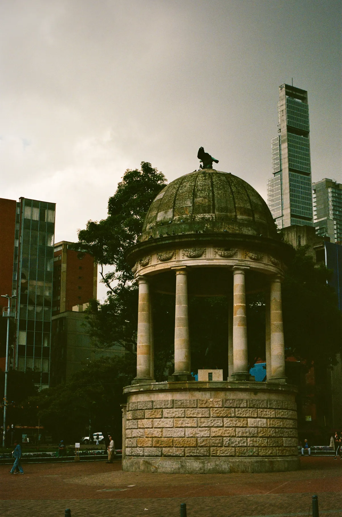 A domed stone pavilion beneath a gray sky in Bogota